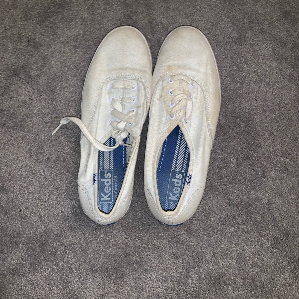 Lightly worn white keds